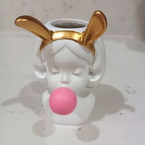 Bunny girl blowing bubble bud vase